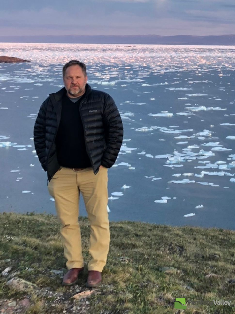 a man stands on a shore